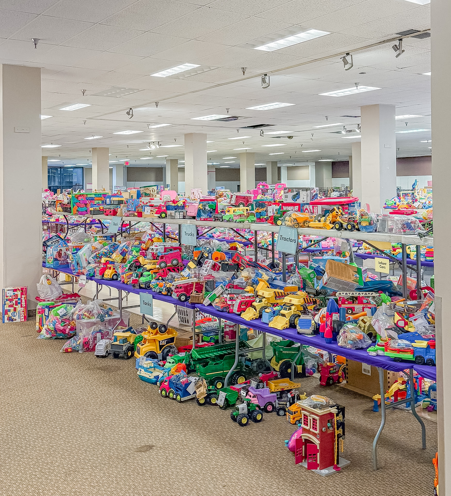 Wide angle of tables covered with toys