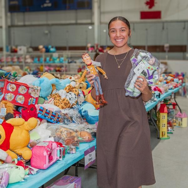 woman smiling and shopping for toys
