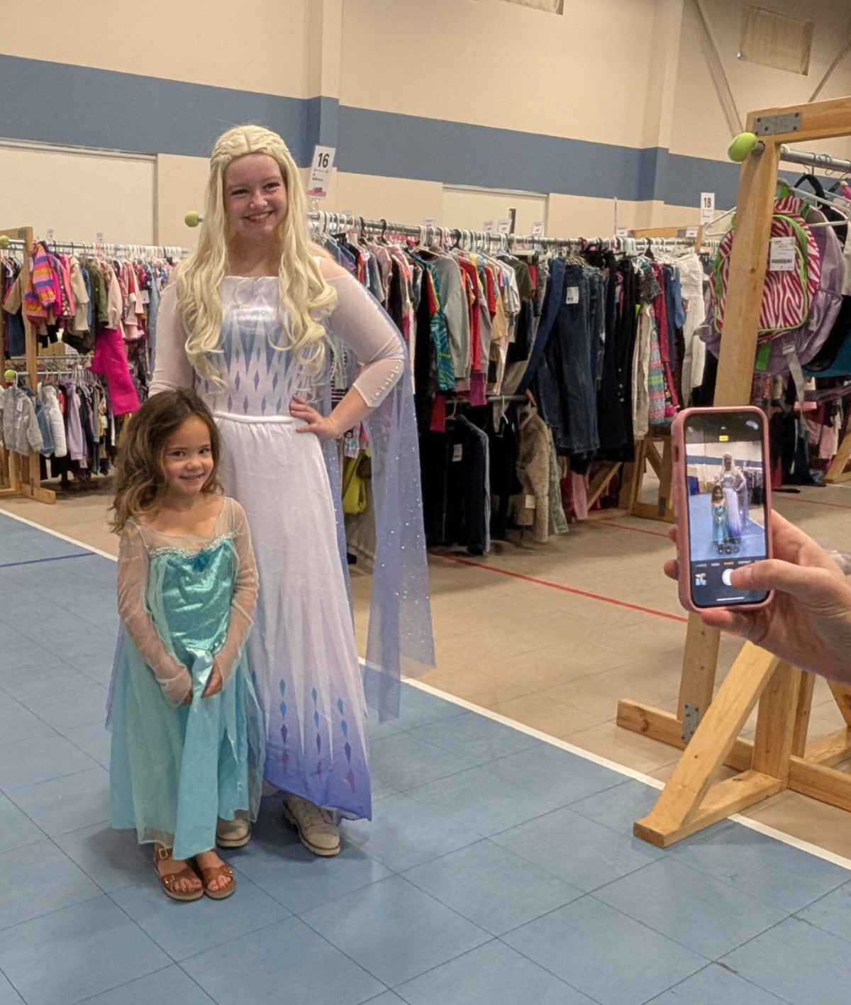 child dressed as Elsa with adult dressed as Elsa