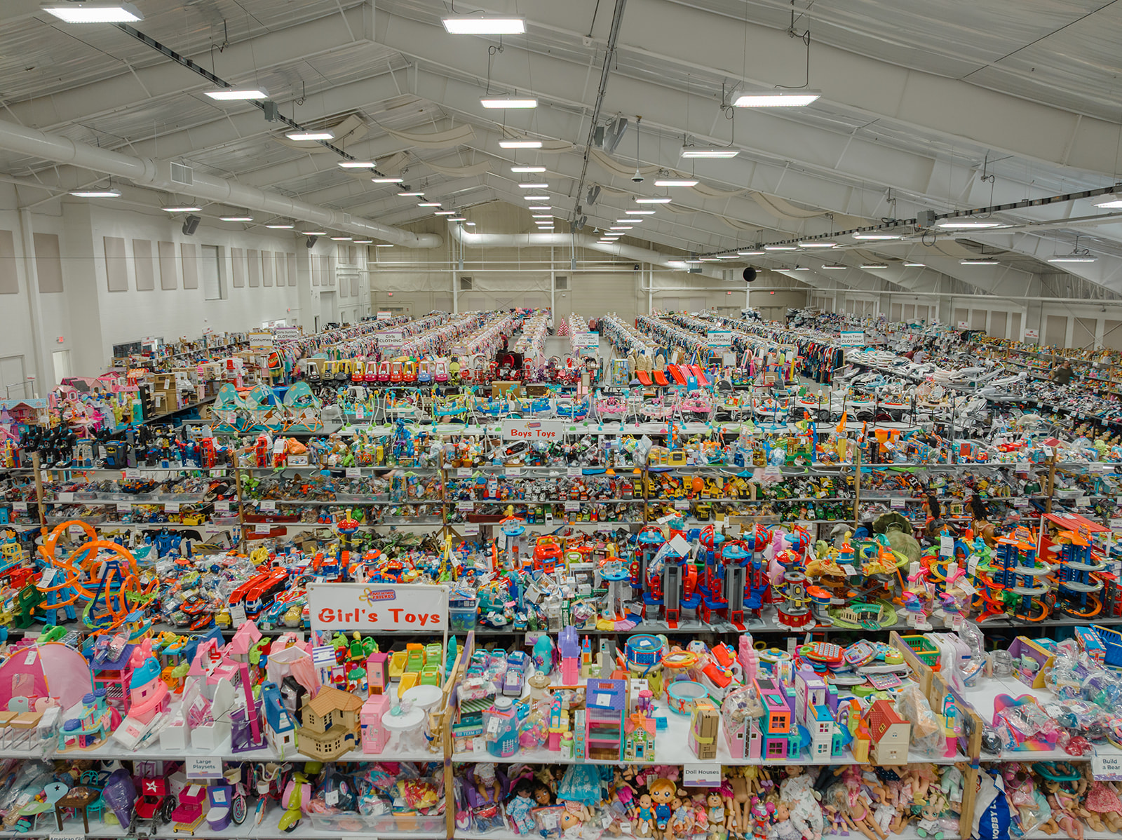 JBF Harrington Children's sale filled with long tables of toys and clothes