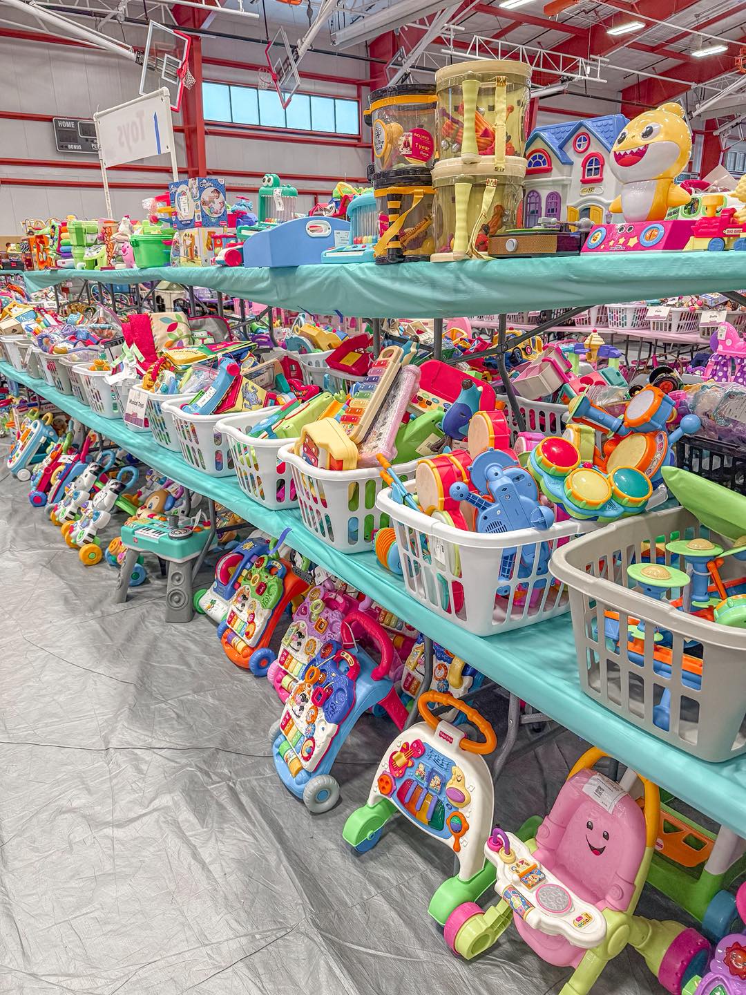Tables stacked and full of toddler toys