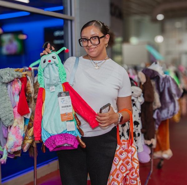 woman holding a halloween costume