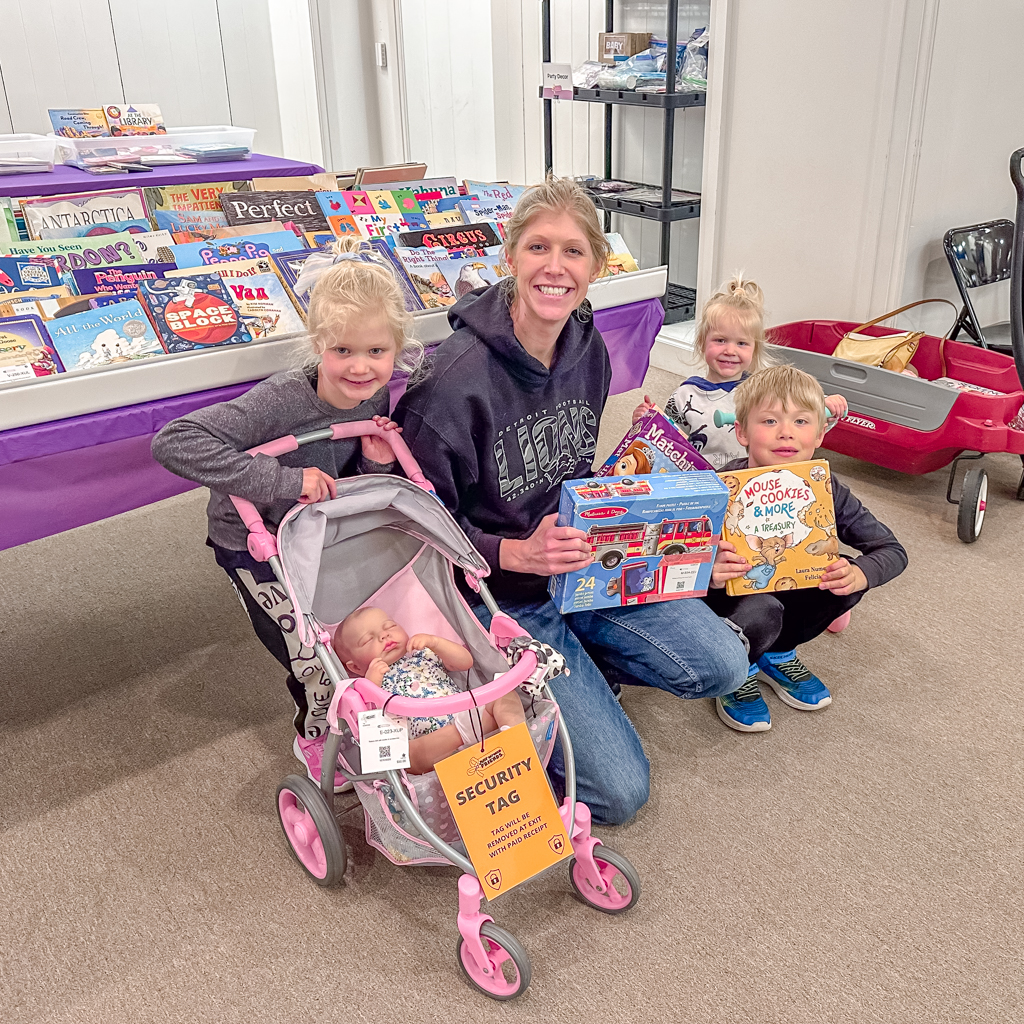 Mom and her 3 kids shopping
