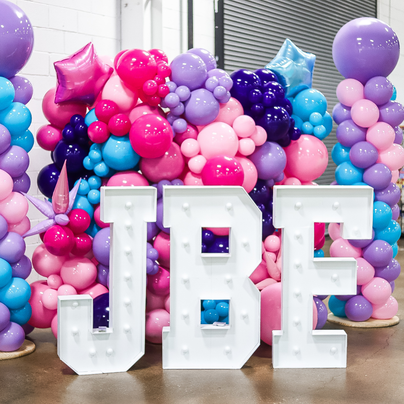 balloons with the letters JBF in front of them