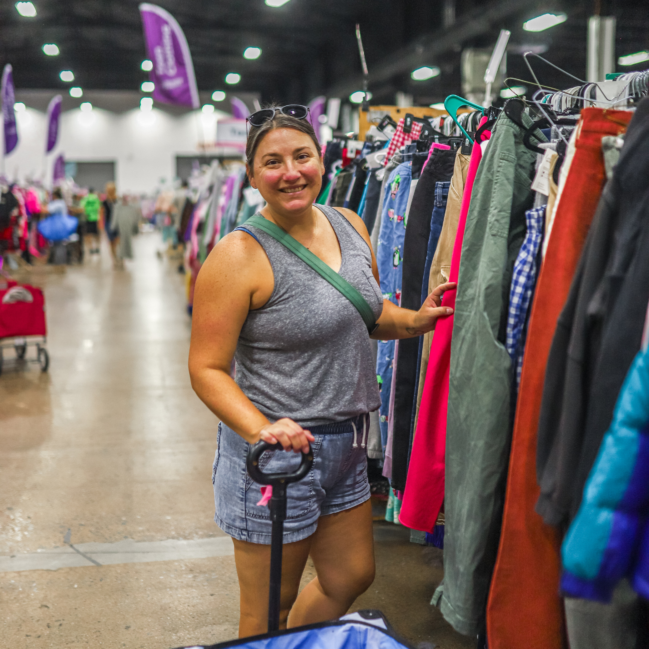 woman shopping for clothing at a sale