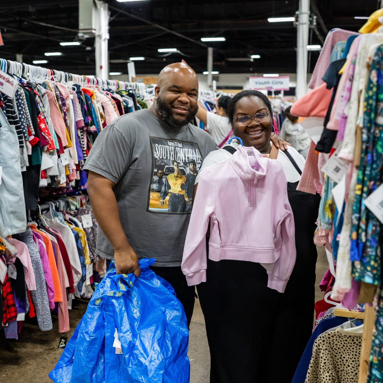 smiling man and woman shopping